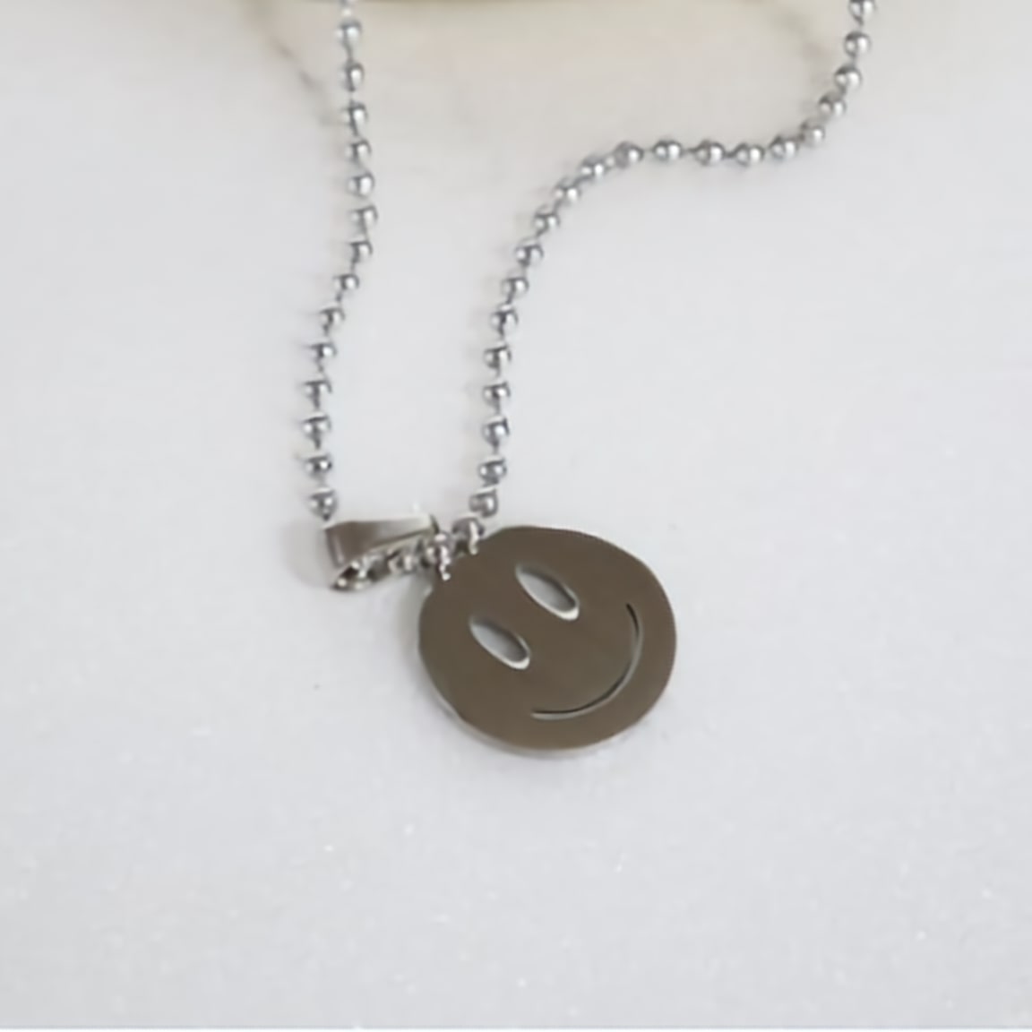 producing surgical (stainless) necklace